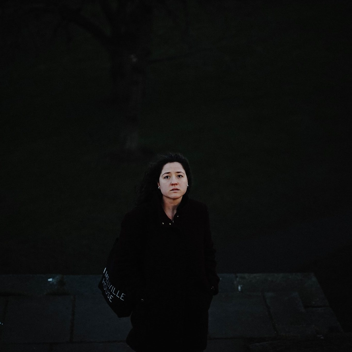 woman surrounded in black